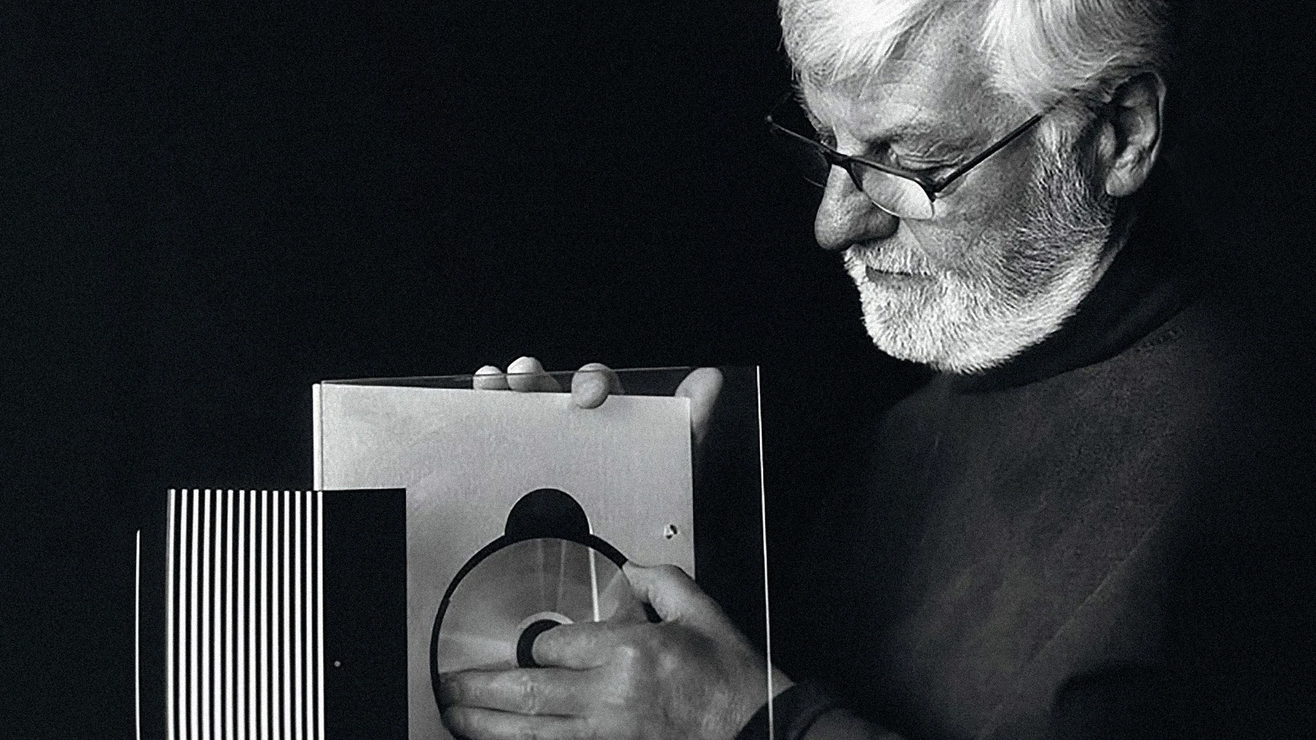 David Lewis with a Bang & Olufsen CD player 