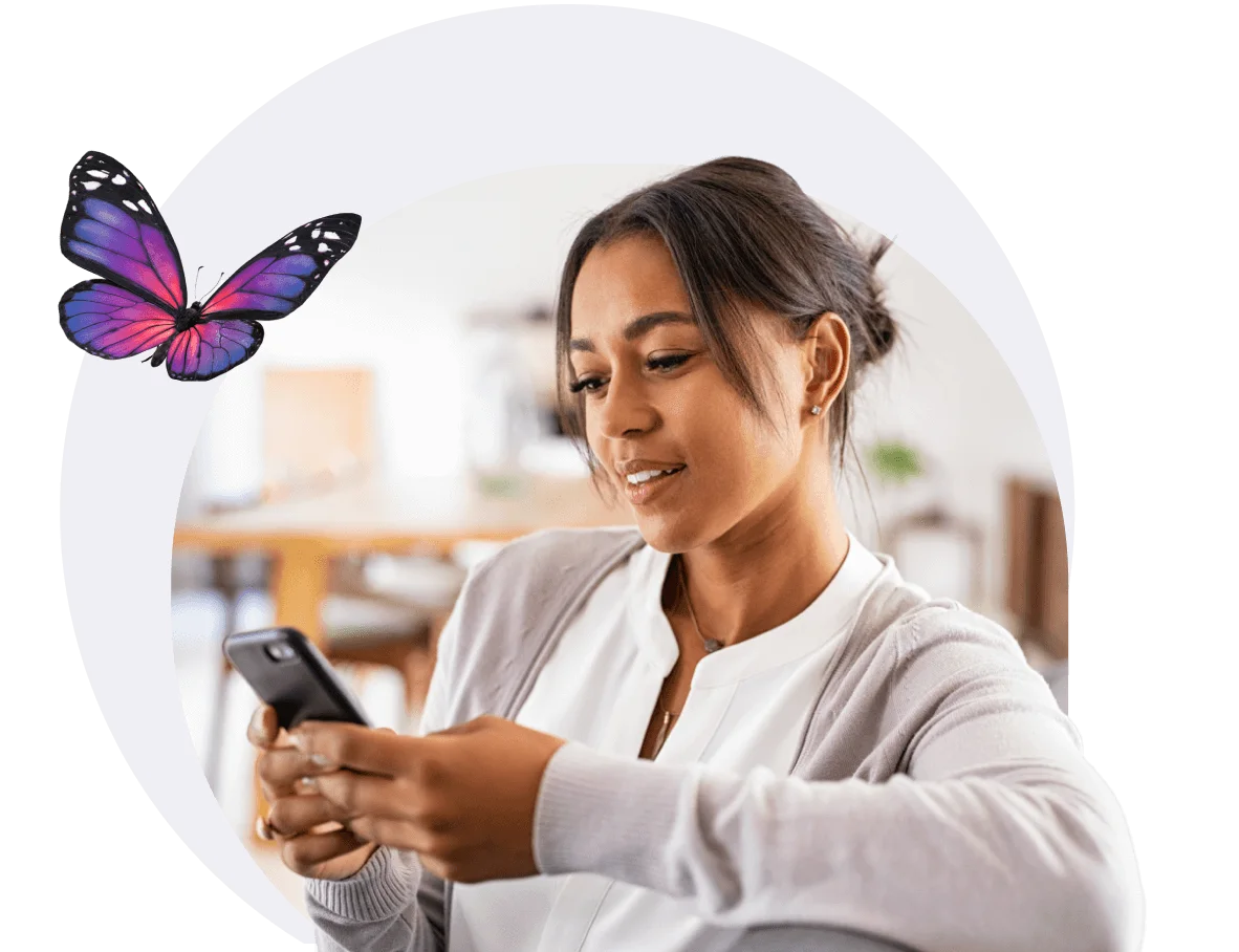 A woman using the My TELUS app on her phone to manage her account.