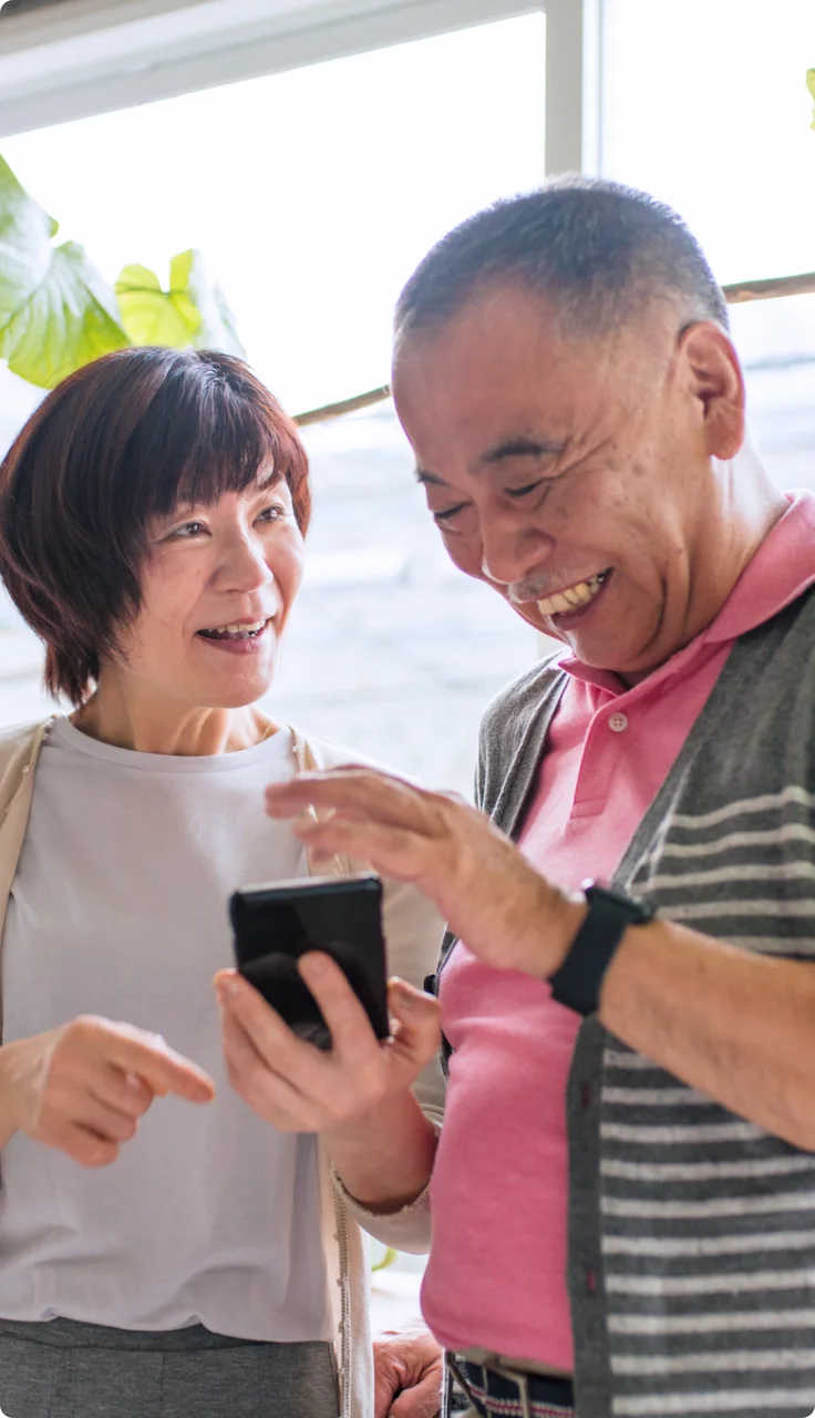 A family using a tablet together in their home