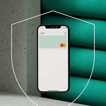 Mobile with N26 virtual card and a shieln on the background.