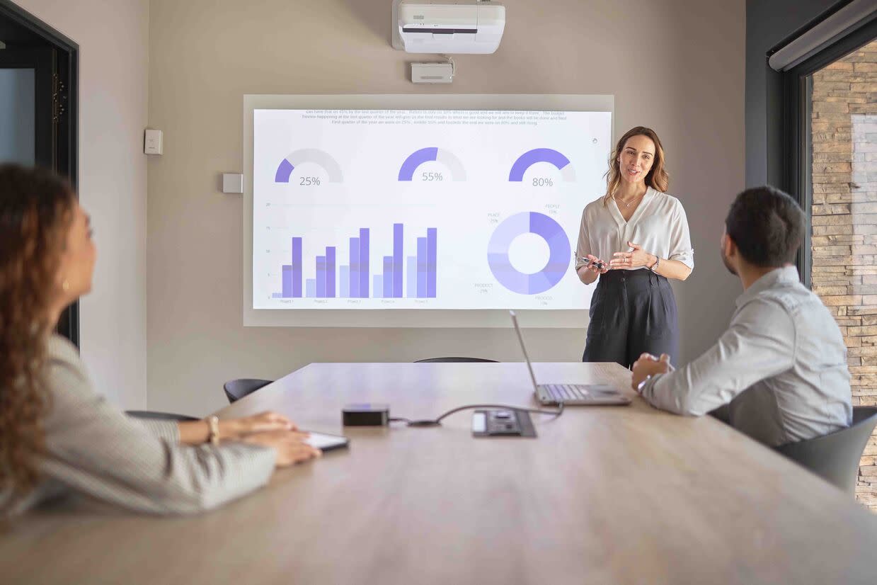 A woman presents on trade promotion management and spend optimization strategies.